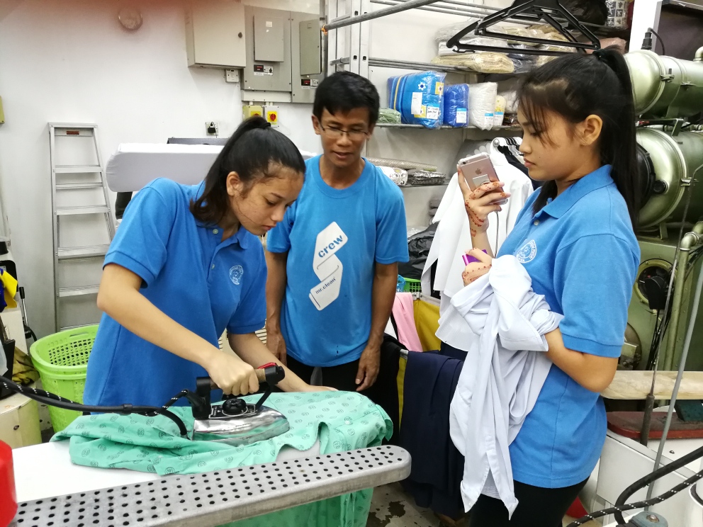Students learn how to iron